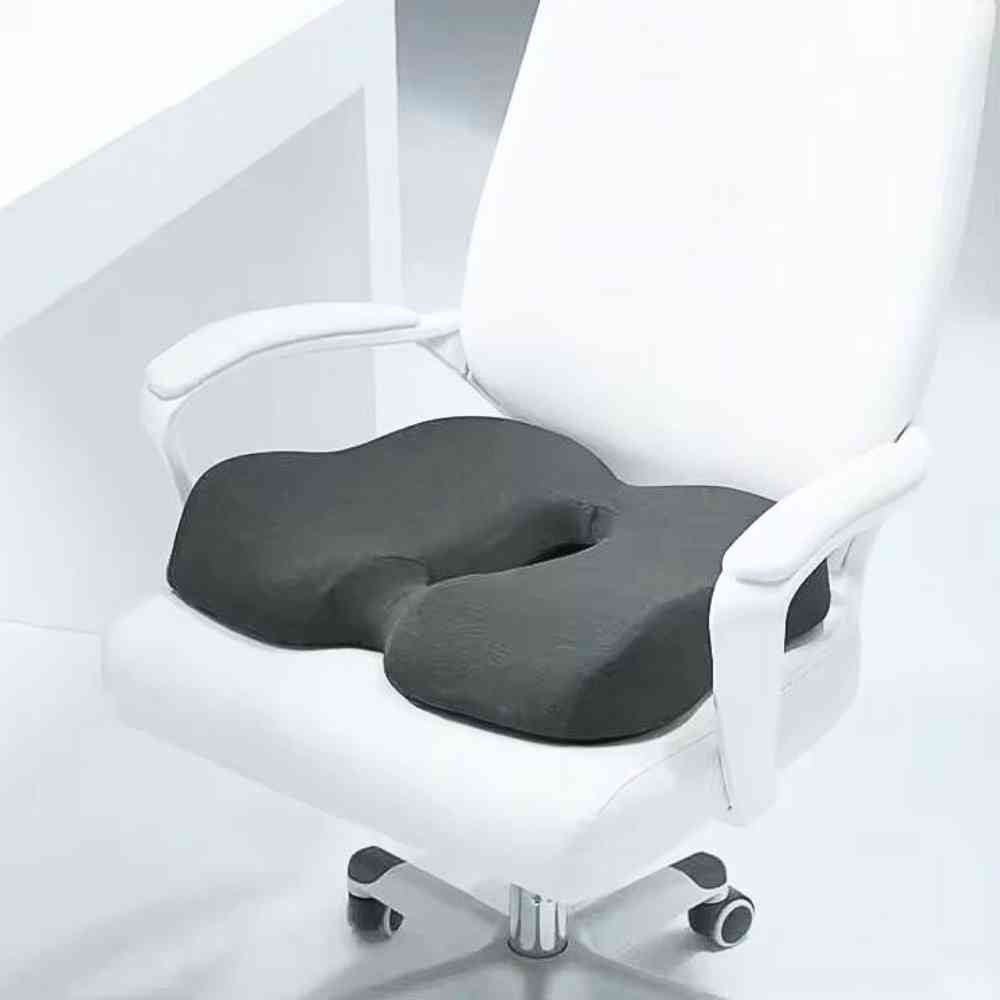Coussin Hémorroïdes Pharmacie​ gris sur un siège