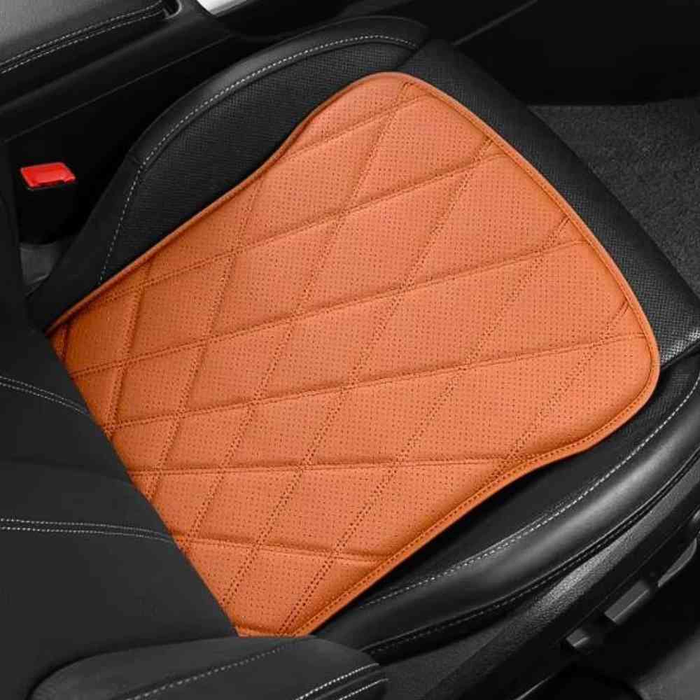 Coussin Voiture Fessier​ Cuire pu orange sur un siège