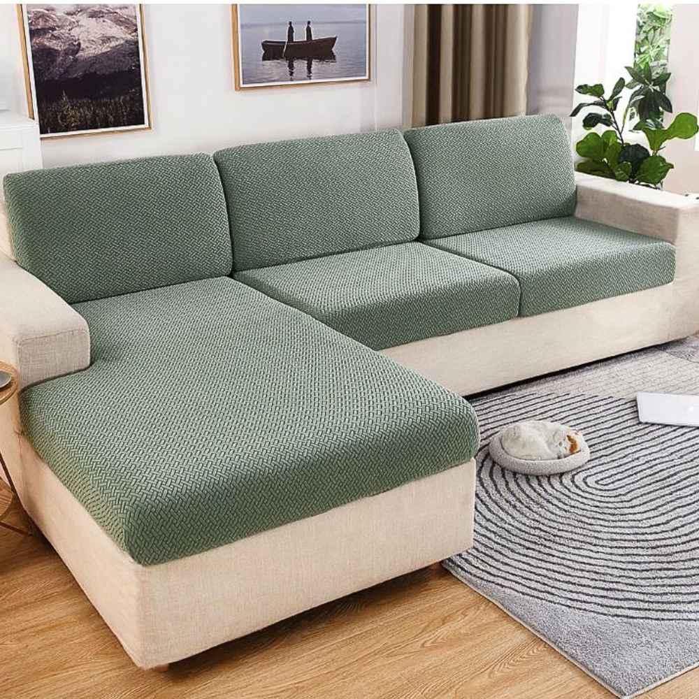 Un salon avec la Housse de Canapé Extensible vert